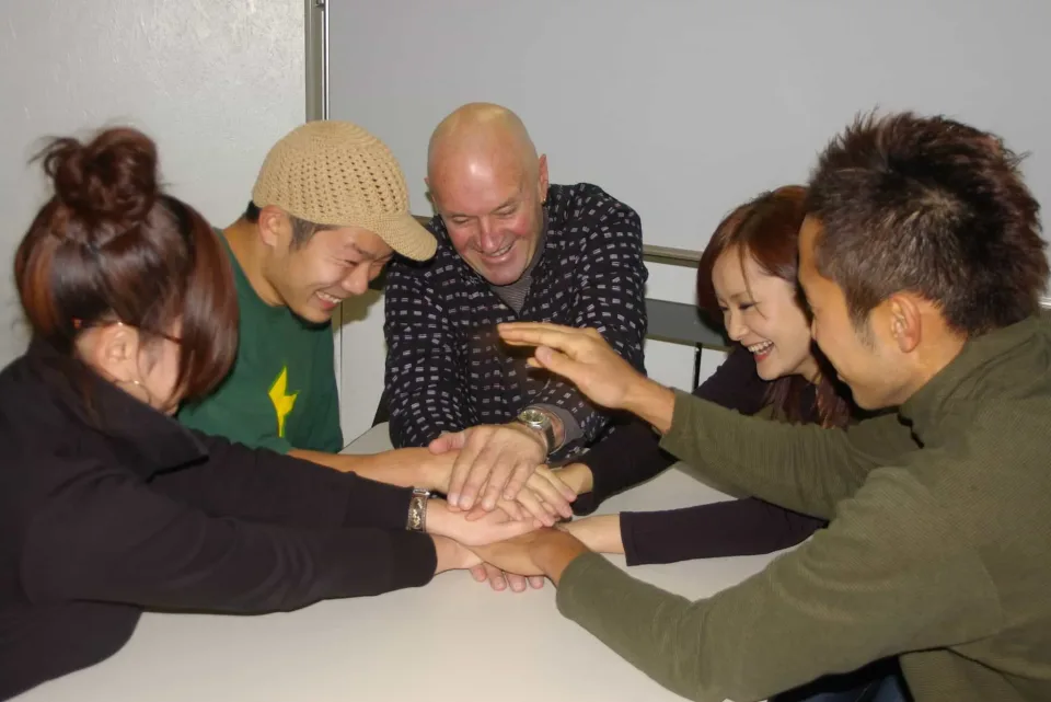 Group Lesson - students and the teacher playing a game