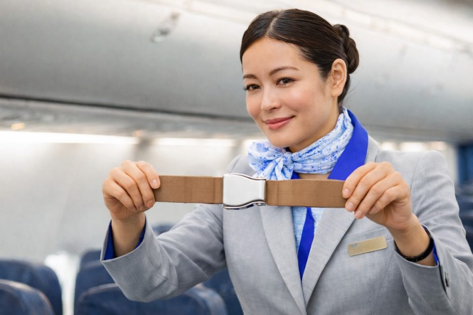 Flight attendant doing safety demonstration - holding belt | CA・客室乗務員向け英語